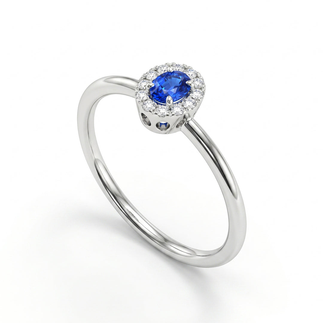 Nihama an 18k oval sapphire 4x3 with diamond outline and smooth shank NA5233O4ZFD