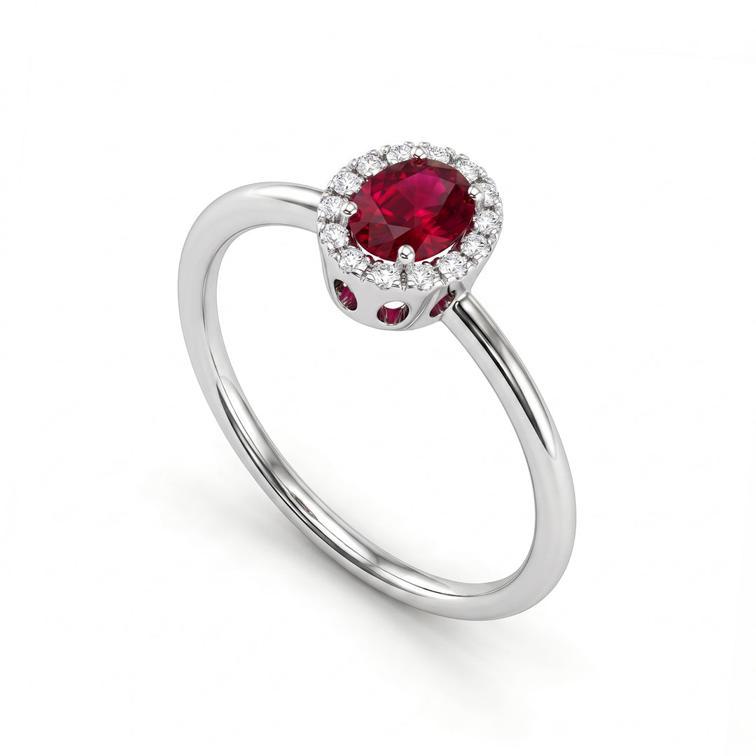 Nihama an 18k oval ruby 5x4 with diamond outline and smooth shank NA5234O4RBN