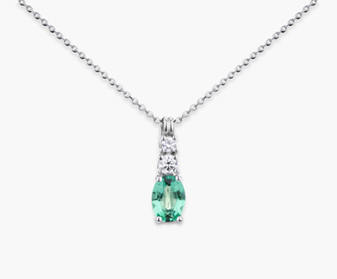 Nihama cl 18k emerald n. oval 7x5 ct.0.60 dia ct.0.15 ND5056O4SMN060