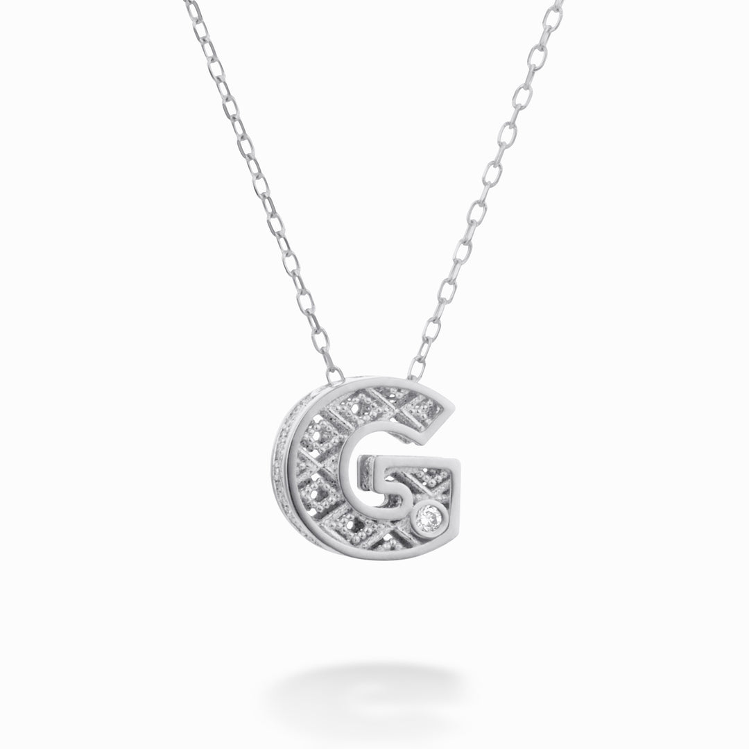 Nihama cl 18k letter g white gold diam. ct.0,01 NDLETGO4